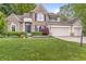 Beautiful two-story home with well-maintained landscaping and a three-car garage at 6833 Bluffridge Ln, Indianapolis, IN 46278