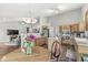 Open concept kitchen and living room with eat-in kitchen, wood cabinets, and stainless appliances at 6833 Bluffridge Ln, Indianapolis, IN 46278