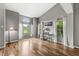 Bright living room with hardwood floors, large windows, and neutral decor, creating a welcoming atmosphere at 6833 Bluffridge Ln, Indianapolis, IN 46278