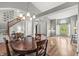 Inviting Living Space With Hardwood Flooring, Staircase and Large Windows at 6833 Bluffridge Ln, Indianapolis, IN 46278