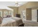 Comfortable main bedroom suite with large windows, vaulted ceilings, and an ensuite bathroom at 6833 Bluffridge Ln, Indianapolis, IN 46278
