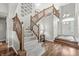 Elegant staircase with wood railings and carpeted steps, leading to the upper level of the home at 6833 Bluffridge Ln, Indianapolis, IN 46278