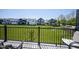 A serene view from the deck overlooking a spacious lawn and charming homes in a vibrant community at 6871 Adalene Ln, Carmel, IN 46033