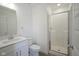 Modern bathroom features a white vanity, toilet and a glass enclosed shower at 6871 Adalene Ln, Carmel, IN 46033