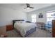 Well-lit bedroom with a bed, a desk, and two windows providing plenty of natural light at 6871 Adalene Ln, Carmel, IN 46033