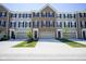 Charming townhome featuring a well-maintained lawn, attached garage and inviting curb appeal at 6871 Adalene Ln, Carmel, IN 46033