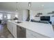 Spacious kitchen with stainless steel appliances, large island, and view into the living area at 6871 Adalene Ln, Carmel, IN 46033