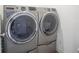 Modern laundry room showcasing high-efficiency washer and dryer units for convenient home care at 6871 Adalene Ln, Carmel, IN 46033