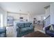 Open-concept living area with modern kitchen, comfortable seating, and hardwood flooring at 6871 Adalene Ln, Carmel, IN 46033