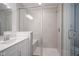 Elegant bathroom features a glass-enclosed shower with a built-in seat and modern fixtures at 6871 Adalene Ln, Carmel, IN 46033