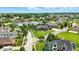 Extensive aerial view showcasing the home, landscaping, and surrounding community at 7116 Trail Ridge Ln, Indianapolis, IN 46259