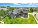 Expansive aerial view of home showcasing landscaping, and inviting entrance at 7116 Trail Ridge Ln, Indianapolis, IN 46259