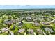 An aerial view shows an established neighborhood with lush trees, private ponds, and well-manicured green spaces at 7116 Trail Ridge Ln, Indianapolis, IN 46259