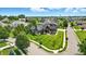 Expansive aerial view of home showcasing landscaping, and neighborhood pond at 7116 Trail Ridge Ln, Indianapolis, IN 46259