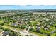 A sprawling neighborhood showcases a blend of housing styles, tree-lined streets, and serene ponds at 7116 Trail Ridge Ln, Indianapolis, IN 46259