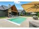 Backyard features a pool, outdoor living space, dining area and lush green lawn at 7116 Trail Ridge Ln, Indianapolis, IN 46259