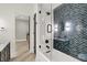 Stylish bathroom with glass shower and trendy tile, blending form and function at 7116 Trail Ridge Ln, Indianapolis, IN 46259