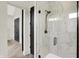 Elegant bathroom with a glass-enclosed shower and marble-style tile at 7116 Trail Ridge Ln, Indianapolis, IN 46259