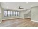 This bedroom offers wood floors, neutral walls, recessed lights, a ceiling fan and lots of light at 7116 Trail Ridge Ln, Indianapolis, IN 46259