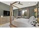 Elegant bedroom featuring a four-poster bed and stylish decor at 7116 Trail Ridge Ln, Indianapolis, IN 46259