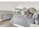 Cozy bedroom features wood floors, neutral walls, recessed lights and plenty of natural light at 7116 Trail Ridge Ln, Indianapolis, IN 46259