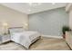 Comfortable bedroom showcases decorative wall paper, and hardwood flooring at 7116 Trail Ridge Ln, Indianapolis, IN 46259