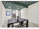 Bonus room features stylish wallpaper, new carpet, and modern lighting at 7116 Trail Ridge Ln, Indianapolis, IN 46259