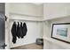Organized closet with shelving and hanging space, featuring a picture and decor at 7116 Trail Ridge Ln, Indianapolis, IN 46259