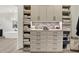 Well-organized closet with built-in shelves, drawers, and cabinet doors for optimal storage at 7116 Trail Ridge Ln, Indianapolis, IN 46259