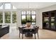 Bright dining area with backyard views, stylish decor, and an open-concept layout at 7116 Trail Ridge Ln, Indianapolis, IN 46259