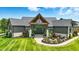 Beautiful home with modern curb appeal and professional landscaping at 7116 Trail Ridge Ln, Indianapolis, IN 46259