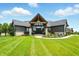 Beautiful home with a modern design, manicured lawn, and inviting entrance, offering curb appeal at 7116 Trail Ridge Ln, Indianapolis, IN 46259
