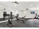 Bright, well-equipped home gym with exercise machines, mirrored wall and durable flooring at 7116 Trail Ridge Ln, Indianapolis, IN 46259