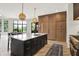 Well-appointed kitchen with island seating and an open layout to the dining area at 7116 Trail Ridge Ln, Indianapolis, IN 46259