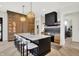 Gourmet kitchen features a large island with seating, custom cabinetry, and designer lighting at 7116 Trail Ridge Ln, Indianapolis, IN 46259