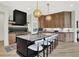 Modern kitchen with a large island, marble countertops, and stainless steel appliances at 7116 Trail Ridge Ln, Indianapolis, IN 46259