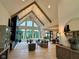 Spacious living room with vaulted ceilings, large windows, and an open floor plan at 7116 Trail Ridge Ln, Indianapolis, IN 46259