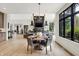 Spacious open-concept home with a dining area, living space, and modern design elements at 7116 Trail Ridge Ln, Indianapolis, IN 46259