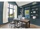 Well-lit home office with built-in bookshelves and a view of the landscaped yard at 7116 Trail Ridge Ln, Indianapolis, IN 46259