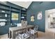 Stylish office with built-in bookshelves, modern desk, and contemporary decor at 7116 Trail Ridge Ln, Indianapolis, IN 46259