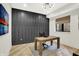 This home office features built-in storage, natural light, and hardwood floors at 7116 Trail Ridge Ln, Indianapolis, IN 46259