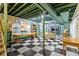Finished basement with checkered floors, exposed ceiling and ample room for recreation at 7182 Hunt Club Dr, Zionsville, IN 46077