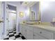 Bright bathroom with white vanity, vessel sink, and a separate shower room at 7182 Hunt Club Dr, Zionsville, IN 46077