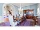 Formal dining room with a large table, china cabinet, and chandelier, perfect for elegant gatherings at 7182 Hunt Club Dr, Zionsville, IN 46077