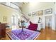 Spacious foyer featuring a grand staircase, hardwood floors, and a view into multiple rooms at 7182 Hunt Club Dr, Zionsville, IN 46077