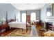 Elegant main bedroom featuring a four-poster bed, fireplace, and hardwood floors at 7182 Hunt Club Dr, Zionsville, IN 46077