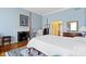 Spacious main bedroom with four-poster bed, fireplace, and classic decor at 7182 Hunt Club Dr, Zionsville, IN 46077