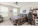 Bright bedroom with modern lighting, gaming decor, and natural light from two windows at 7258 Selah Ln, Noblesville, IN 46062
