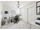 Bright office with a neutral decor, featuring a modern desk and ample natural light at 7258 Selah Ln, Noblesville, IN 46062