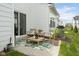 Inviting patio area with outdoor seating, stylish decor, and well-maintained landscaping at 7258 Selah Ln, Noblesville, IN 46062